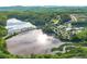 Community aerial view showcasing a lake, pool, tennis courts and surrounding lush greenery at 423 Murphy Ave, Canton, GA 30114