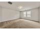 Spacious bedroom featuring neutral carpet, dual windows, and ample space for furniture at 423 Murphy Ave, Canton, GA 30114