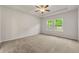 Bright bedroom with large windows, tray ceiling, and neutral carpet flooring at 423 Murphy Ave, Canton, GA 30114