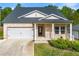 Charming single-Gathering home with brick facade, attached garage, and manicured lawn in a well-kept neighborhood at 423 Murphy Ave, Canton, GA 30114