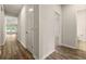 Hallway with wood floors connecting the living areas and featuring neutral wall paint at 423 Murphy Ave, Canton, GA 30114