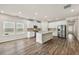 Spacious kitchen with white cabinets, stainless steel appliances, and central island open to the dining area at 423 Murphy Ave, Canton, GA 30114