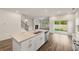 Open kitchen with an island and stainless steel appliances and a view to the backyard at 423 Murphy Ave, Canton, GA 30114