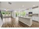 Bright kitchen boasts stainless appliances, granite countertops, and ample natural light at 423 Murphy Ave, Canton, GA 30114