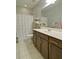 This spacious bathroom features tile flooring, vanity with sink, and shower at 514 Creekshire Cir, Canton, GA 30115