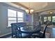 Dining room view with dark wood floor, window and chandelier at 514 Creekshire Cir, Canton, GA 30115
