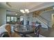 Dining and living room view with a staircase in background at 514 Creekshire Cir, Canton, GA 30115
