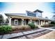 Charming Hampton Station building with stone accents and well-maintained landscaping and decorative train tracks at 514 Creekshire Cir, Canton, GA 30115