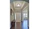 Elegant foyer with hardwood floors, tray ceiling, and a view into the adjacent living spaces at 514 Creekshire Cir, Canton, GA 30115