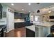 Kitchen showcasing dark wood cabinets, granite counters, stainless appliances and adjacent barstool seating at 514 Creekshire Cir, Canton, GA 30115