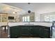 Kitchen featuring granite countertops, a breakfast bar, black appliances, and plenty of natural light at 514 Creekshire Cir, Canton, GA 30115