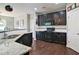 Modern kitchen with dark wood cabinets, stainless steel appliances, granite countertops, and hardwood flooring at 514 Creekshire Cir, Canton, GA 30115