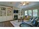 Bright living room featuring built-in shelves and a fireplace at 514 Creekshire Cir, Canton, GA 30115