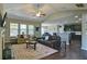 Open living room with many windows and hardwood floors at 514 Creekshire Cir, Canton, GA 30115