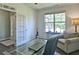 Cozy office space with a comfortable chair, glass desk, and plenty of natural light at 514 Creekshire Cir, Canton, GA 30115