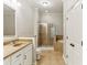 Well lit bathroom with double sinks, a walk-in shower, soaking tub, and tiled floors at 11 Perimeter E Ctr # 1402, Dunwoody, GA 30346