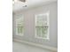 Neutral bedroom featuring two windows with blind coverings and neutral paint color at 11 Perimeter E Ctr # 1402, Dunwoody, GA 30346
