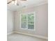 Spacious bedroom featuring a large window with blind coverings and neutral paint color at 11 Perimeter E Ctr # 1402, Dunwoody, GA 30346