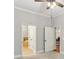 Neutral primary bedroom showing a ceiling fan and access to the bathroom at 11 Perimeter E Ctr # 1402, Dunwoody, GA 30346