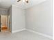 Neutral primary bedroom featuring a ceiling fan and access to the bathroom and closet at 11 Perimeter E Ctr # 1402, Dunwoody, GA 30346