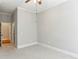 A bright bedroom offers neutral walls, carpeted floor, and a ceiling fan at 11 Perimeter E Ctr # 1402, Dunwoody, GA 30346
