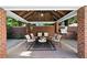 Outdoor kitchen and seating area within the clubhouse with grilling, and multiple seating options at 11 Perimeter E Ctr # 1402, Dunwoody, GA 30346