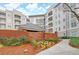 Community entrance to The Prescott at Park Place Luxury Condominiums with manicured flowerbeds at 11 Perimeter E Ctr # 1402, Dunwoody, GA 30346