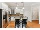 Kitchen with island seating, stainless steel appliances, and granite countertops at 11 Perimeter E Ctr # 1402, Dunwoody, GA 30346