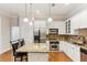 Modern kitchen with granite countertops, stainless steel appliances, and white cabinets at 11 Perimeter E Ctr # 1402, Dunwoody, GA 30346