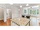 Kitchen island with seating, connecting the kitchen area to the bright and open living room at 11 Perimeter E Ctr # 1402, Dunwoody, GA 30346