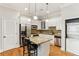 Well-lit kitchen featuring white cabinets, granite counters, and stainless steel appliances at 11 Perimeter E Ctr # 1402, Dunwoody, GA 30346
