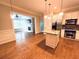 Open kitchen featuring granite island, stainless steel appliances, and hardwood floors at 11 Perimeter E Ctr # 1402, Dunwoody, GA 30346