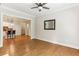 Open living room with hardwood floors connected to the kitchen with a breakfast bar at 11 Perimeter E Ctr # 1402, Dunwoody, GA 30346