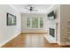 Cozy living room with a fireplace, large windows, and hardwood floors at 11 Perimeter E Ctr # 1402, Dunwoody, GA 30346
