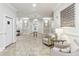 Inviting condo lobby with neutral paint, tiled floors, elegant lighting, and comfortable seating at 11 Perimeter E Ctr # 1402, Dunwoody, GA 30346