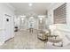Elegant lobby area with seating, decorative lighting, and tile flooring at 11 Perimeter E Ctr # 1402, Dunwoody, GA 30346