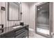 Stylish bathroom features a modern vanity, a sleek mirror, and a glass-enclosed shower at 1191 W Conway Dr, Atlanta, GA 30327