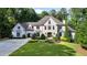 Stunning two-story home with a meticulously landscaped front yard and port cochere at 1191 W Conway Dr, Atlanta, GA 30327
