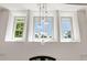 Bright foyer with large windows and a modern chandelier, creating a welcoming and airy atmosphere at 1191 W Conway Dr, Atlanta, GA 30327