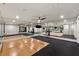 Spacious home gym features mirrored walls, varied flooring, and ample space for workout equipment at 1191 W Conway Dr, Atlanta, GA 30327