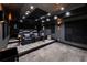 Home theater with tiered seating, plush leather chairs, and dark decor for an immersive viewing experience at 1191 W Conway Dr, Atlanta, GA 30327