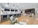 Open living space with bar seating, multiple TVs, and access to other living areas at 1191 W Conway Dr, Atlanta, GA 30327