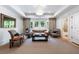 Relaxing living room area, lots of windows, with multiple seating options, and plenty of natural light at 1191 W Conway Dr, Atlanta, GA 30327