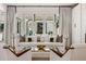 Bright living room featuring a white sofa, decorative pillows, and a view to the outdoors at 1191 W Conway Dr, Atlanta, GA 30327