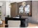 Sophisticated home office with custom built-ins, stylish decor, and a large desk, offering a comfortable workspace at 1191 W Conway Dr, Atlanta, GA 30327