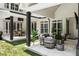 Wide view of the patio with multiple seating areas, artificial grass and exterior view of the back of the home at 1191 W Conway Dr, Atlanta, GA 30327