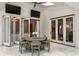 Enclosed sun room with folding doors, a ceiling fan, and comfortable seating at 1191 W Conway Dr, Atlanta, GA 30327