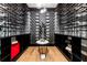 Spacious wine cellar features extensive shelving, decorative lighting, and a marble-topped display table at 1191 W Conway Dr, Atlanta, GA 30327