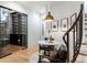 Elegant wine room boasts a tasting table, glass enclosed storage and nearby access to the staircase at 1191 W Conway Dr, Atlanta, GA 30327