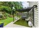 Serene backyard patio with modern pergola, outdoor seating, and lush landscaping, perfect for relaxation and entertaining at 1450 Crescent Walk, Decatur, GA 30033
